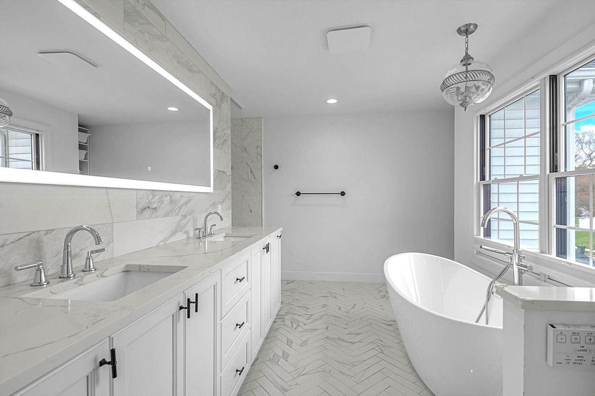 Bathroom, Dual Sink Vanities, Free Standing Baths, Interior, Marble, Marble Walls, Pendant Lights, Recessed Lighting