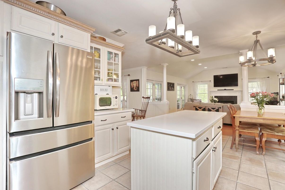 Chandelier, Dining room, Fireplace, Interior, Kitchen, Pendant Lights, Recessed Lighting, Stainless Steel Appliances