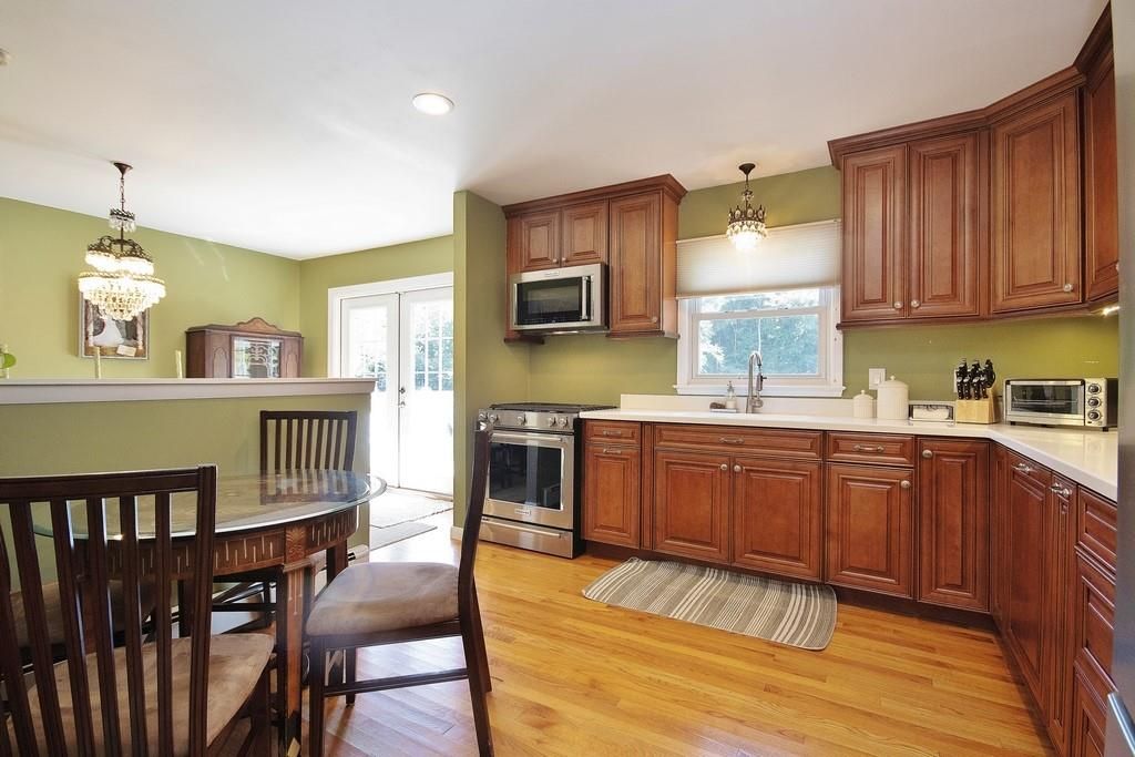 Chandelier, Dining room, Interior, Kitchen, Pendant Lights, Recessed Lighting, Stainless Steel Appliances, Wood Texture Flooring
