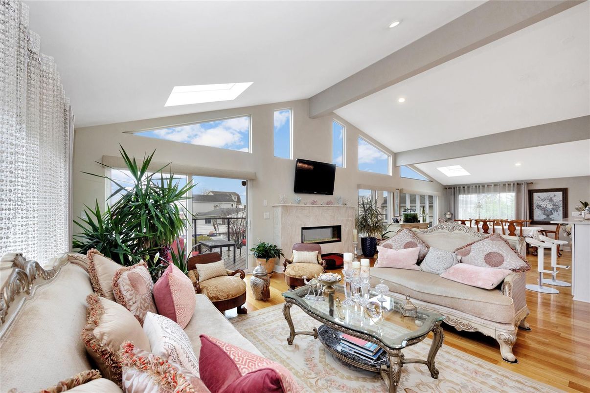 Dining room, Fireplace, Interior, Living room, Recessed Lighting, Wood Texture Flooring