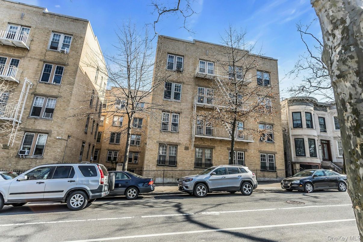 Exterior, Facade, Brick Facade, Condo Building