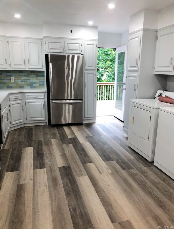 Interior, Kitchen, Recessed Lighting, Stainless Steel Appliances, Washer, Wood Texture Flooring