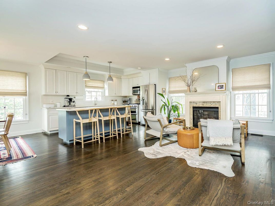 Dining room, Fireplace, Interior, Kitchen, Living room, Pendant Lights, Recessed Lighting, Stainless Steel Appliances, Wood Texture Flooring