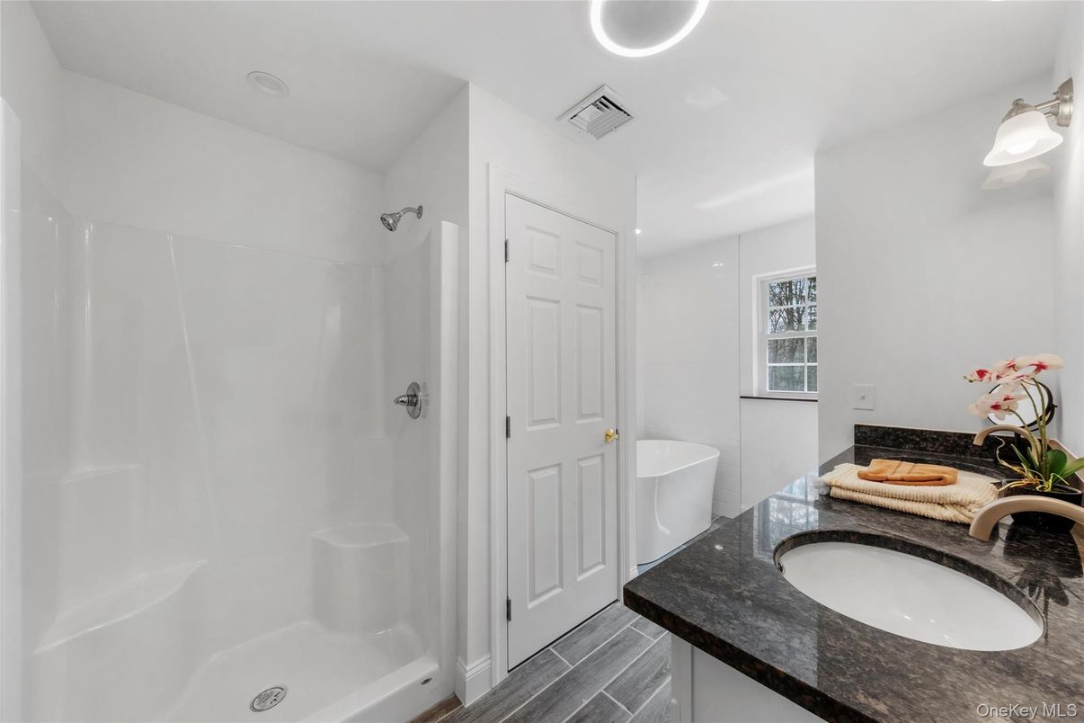 Bathroom, Dual Sink Vanities, Interior, Recessed Lighting, Wood Texture Flooring