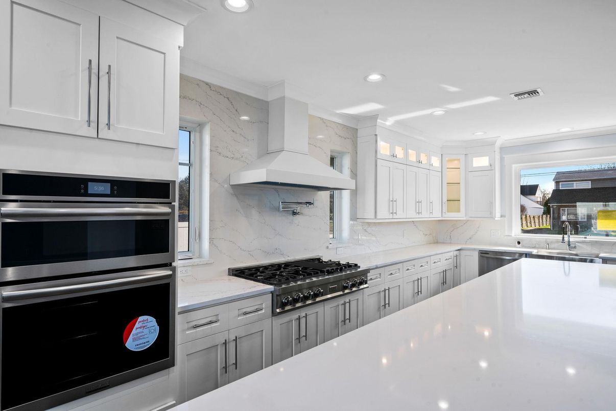 Interior, Kitchen, Marble Walls, Recessed Lighting, Stainless Steel Appliances
