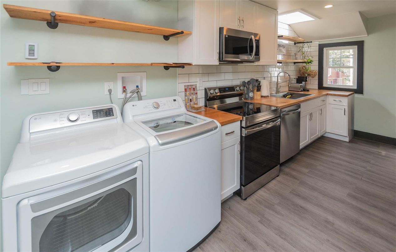 Interior, Kitchen, Recessed Lighting, Washer, Wood Texture Flooring