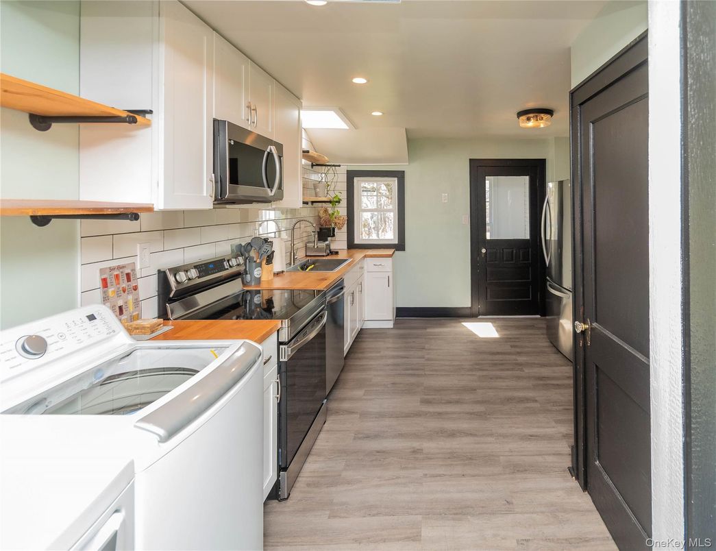 Interior, Kitchen, Recessed Lighting, Washer, Wood Texture Flooring
