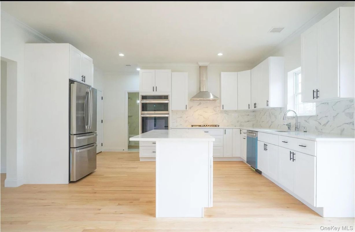 Interior, Kitchen, Marble Walls, Recessed Lighting, Stainless Steel Appliances, Wood Texture Flooring