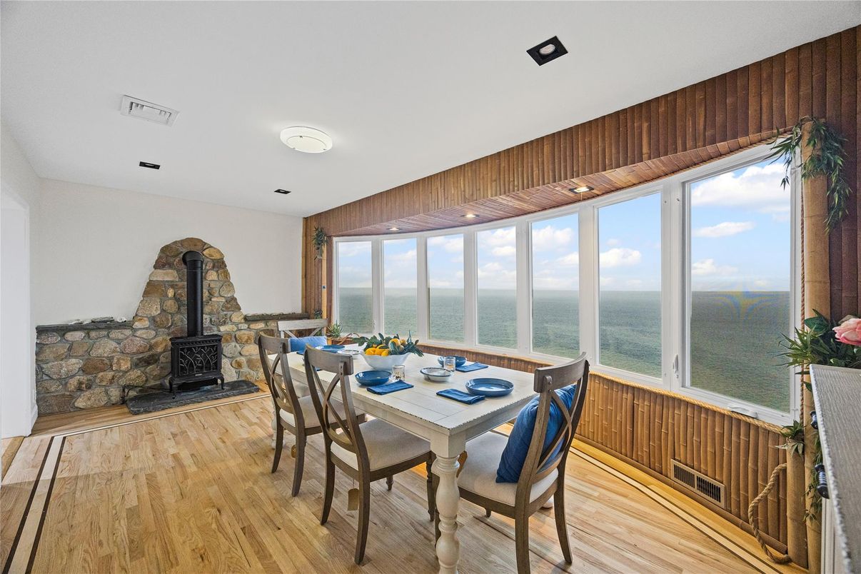Dining room, Fireplace, Interior, Recessed Lighting, Water, Wood Texture Flooring