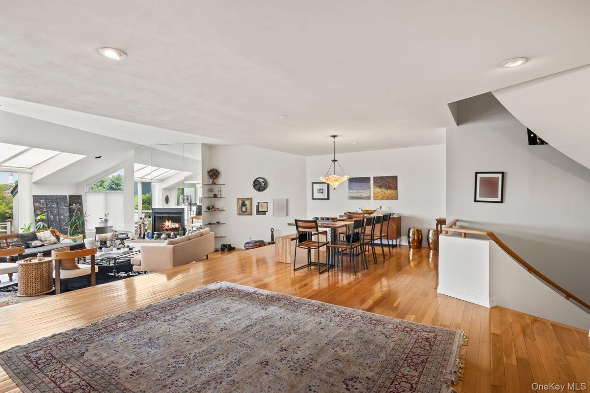 Dining room, Fireplace, Interior, Living room, Pendant Lights, Recessed Lighting, Wood Texture Flooring
