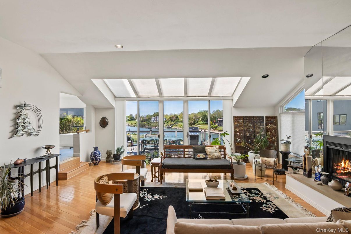 Fireplace, Interior, Living room, Recessed Lighting, Water, Wood Texture Flooring