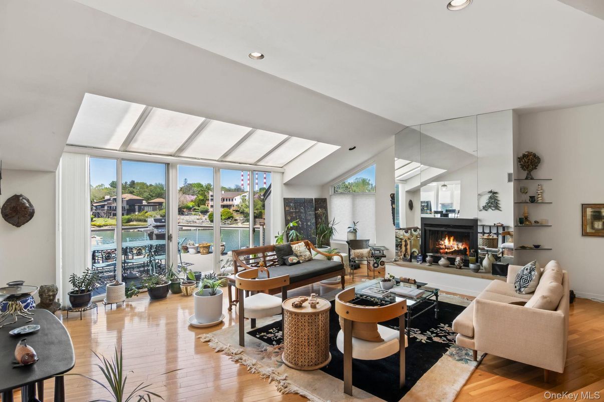 Fireplace, Interior, Living room, Recessed Lighting, Water, Wood Texture Flooring