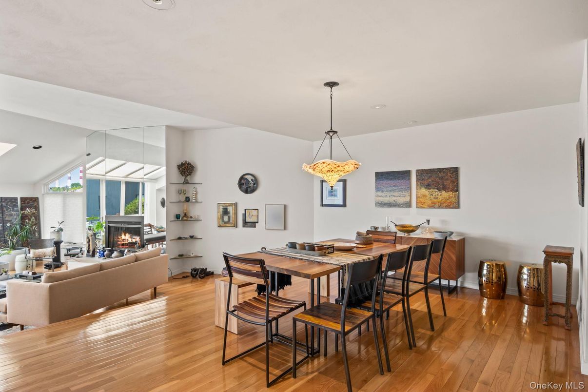 Dining room, Fireplace, Interior, Living room, Pendant Lights, Recessed Lighting, Wood Texture Flooring