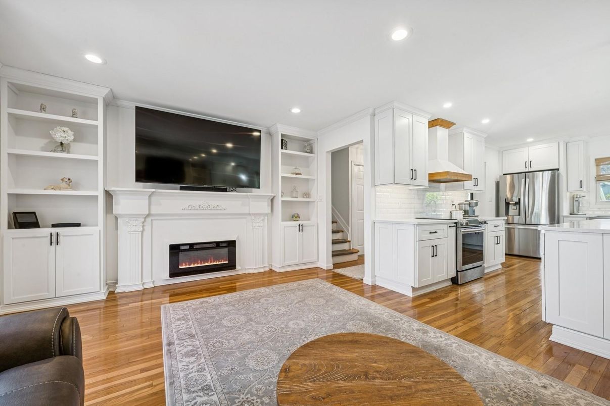 Fireplace, Interior, Kitchen, Recessed Lighting, Stainless Steel Appliances, Wood Texture Flooring