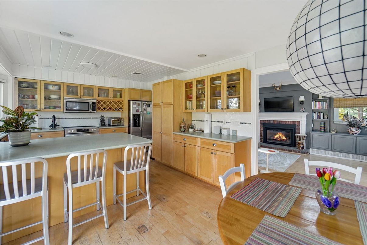 Fireplace, Interior, Kitchen, Stainless Steel Appliances, Wood Texture Flooring