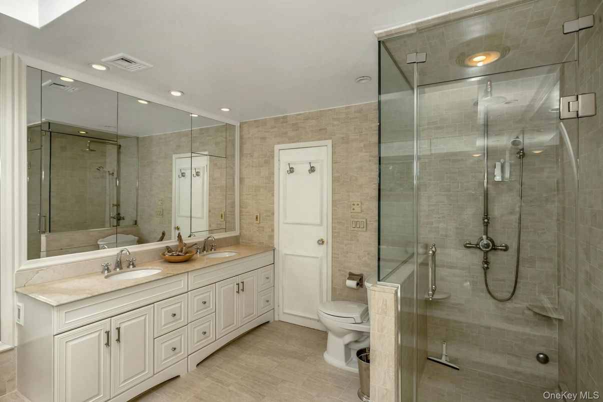 Bathroom, Dual Sink Vanities, Glass Shower, Interior, Recessed Lighting, Wood Texture Flooring