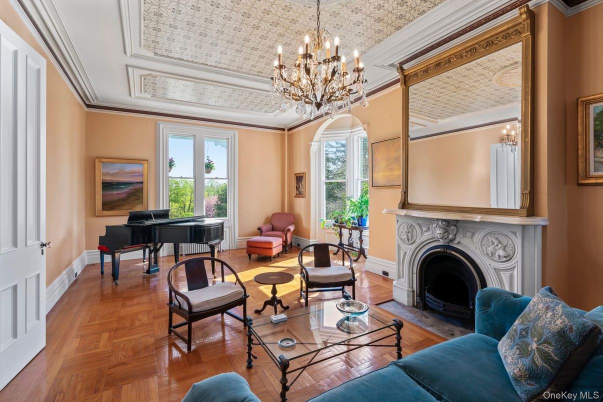 Chandelier, Fireplace, Interior, Living room, Piano, Wood Texture Flooring