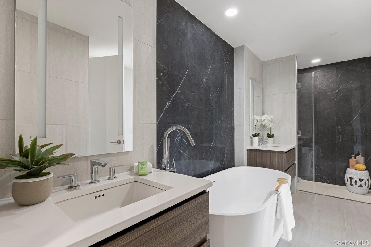 Bathroom, Dual Sink Vanities, Free Standing Baths, Glass Shower, Interior, Marble Walls, Recessed Lighting