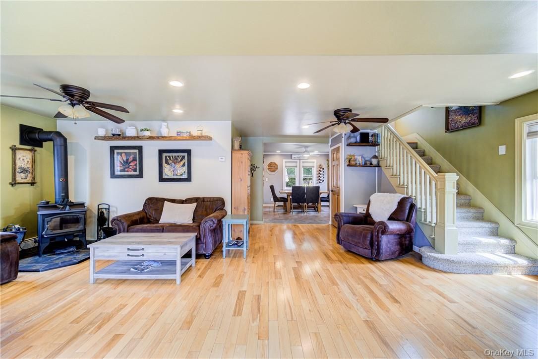 Dining room, Fireplace, Interior, Living room, Recessed Lighting, Wood Texture Flooring