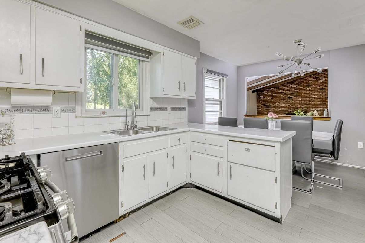 Dining room, Interior, Kitchen, Pendant Lights, Stainless Steel Appliances, Stone Walls, Wood Texture Flooring