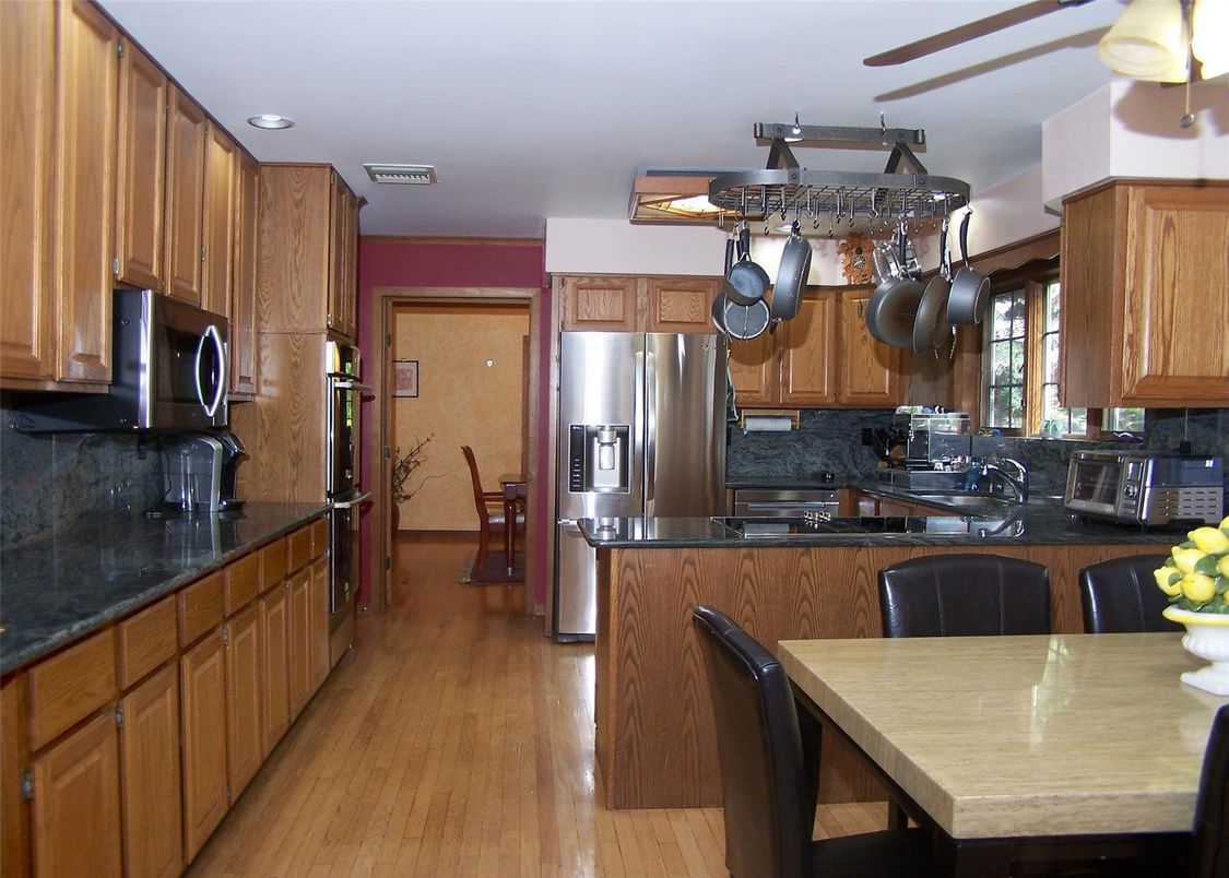 Dining room, Interior, Kitchen, Recessed Lighting, Stainless Steel Appliances, Wood Texture Flooring