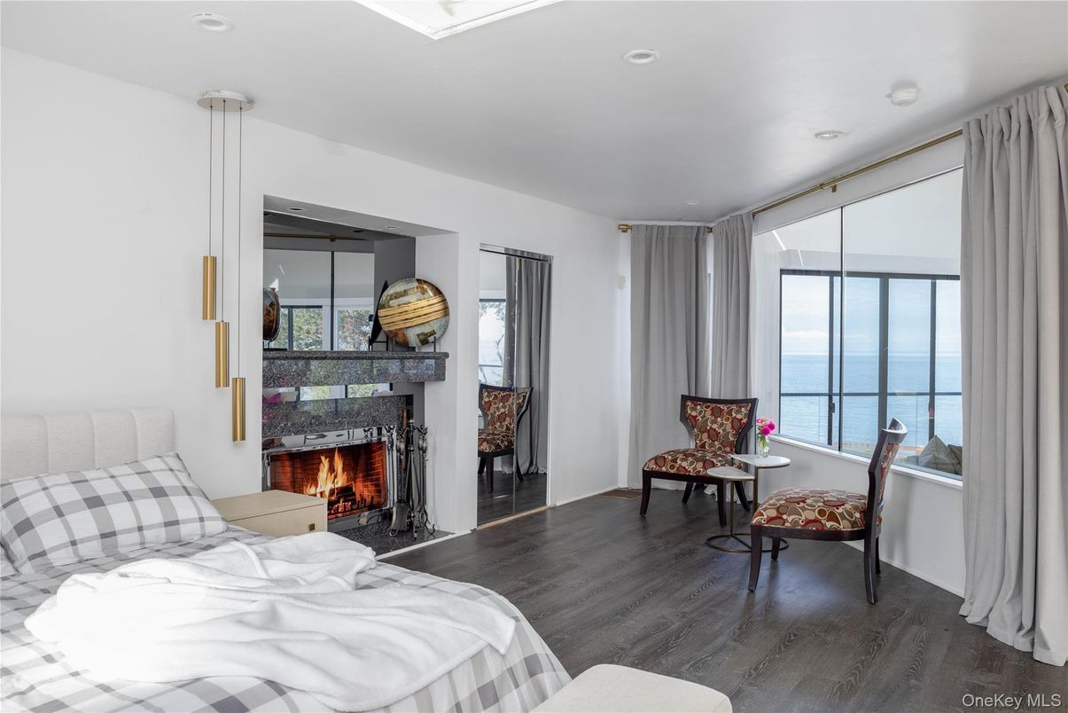 Bedroom, Fireplace, Interior, Recessed Lighting, Water, Wood Texture Flooring