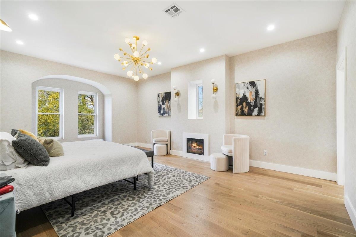 Bedroom, Fireplace, Interior, Pendant Lights, Recessed Lighting, Wood Texture Flooring