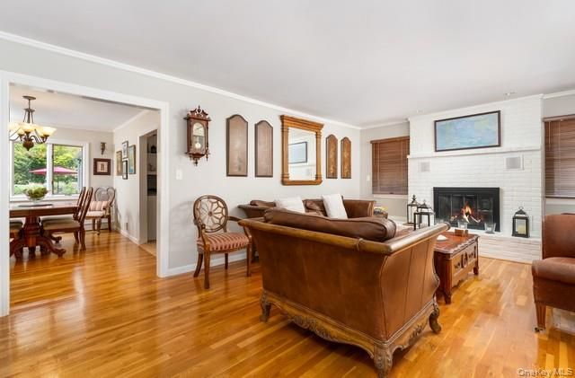 Chandelier, Dining room, Fireplace, Interior, Living room, Pendant Lights, Wood Texture Flooring