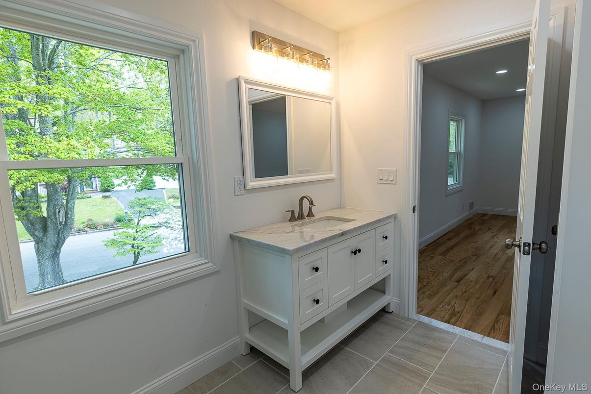 Bathroom, Dual Sink Vanities, Interior, Recessed Lighting, Wood Texture Flooring