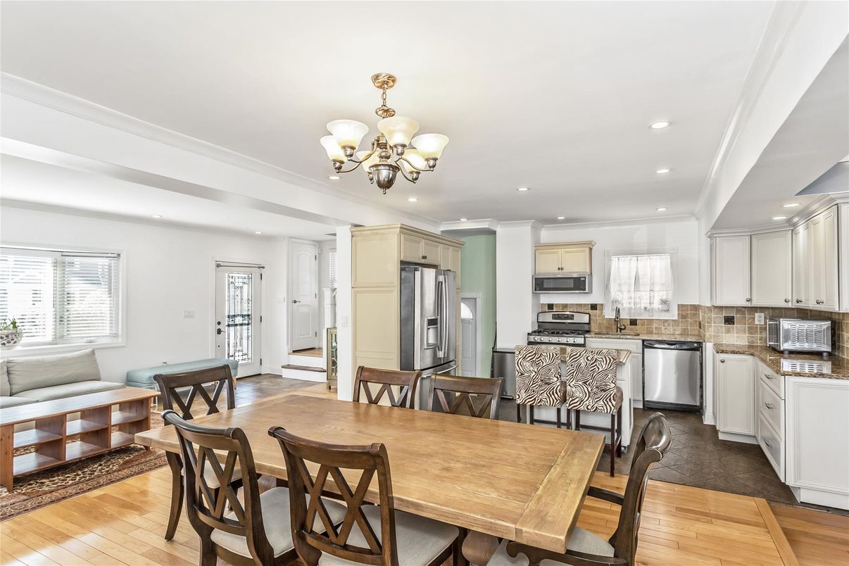 Chandelier, Dining room, Interior, Kitchen, Recessed Lighting, Stainless Steel Appliances, Wood Texture Flooring