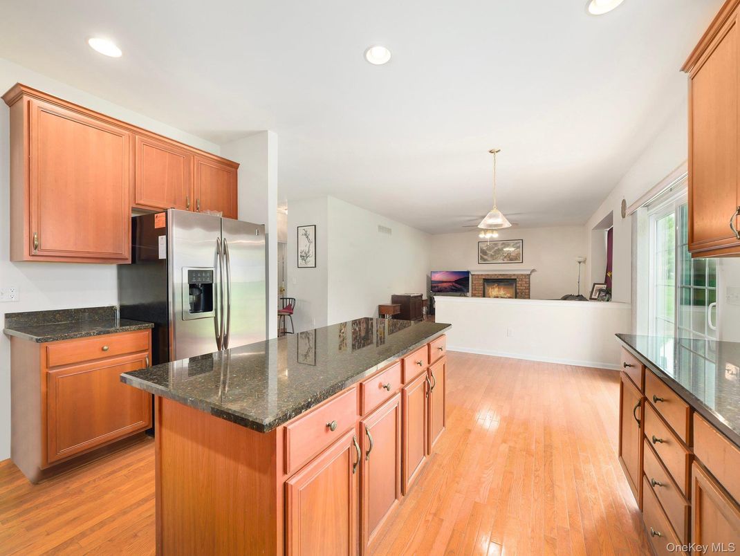 Fireplace, Interior, Kitchen, Pendant Lights, Recessed Lighting, Stainless Steel Appliances, Wood Texture Flooring