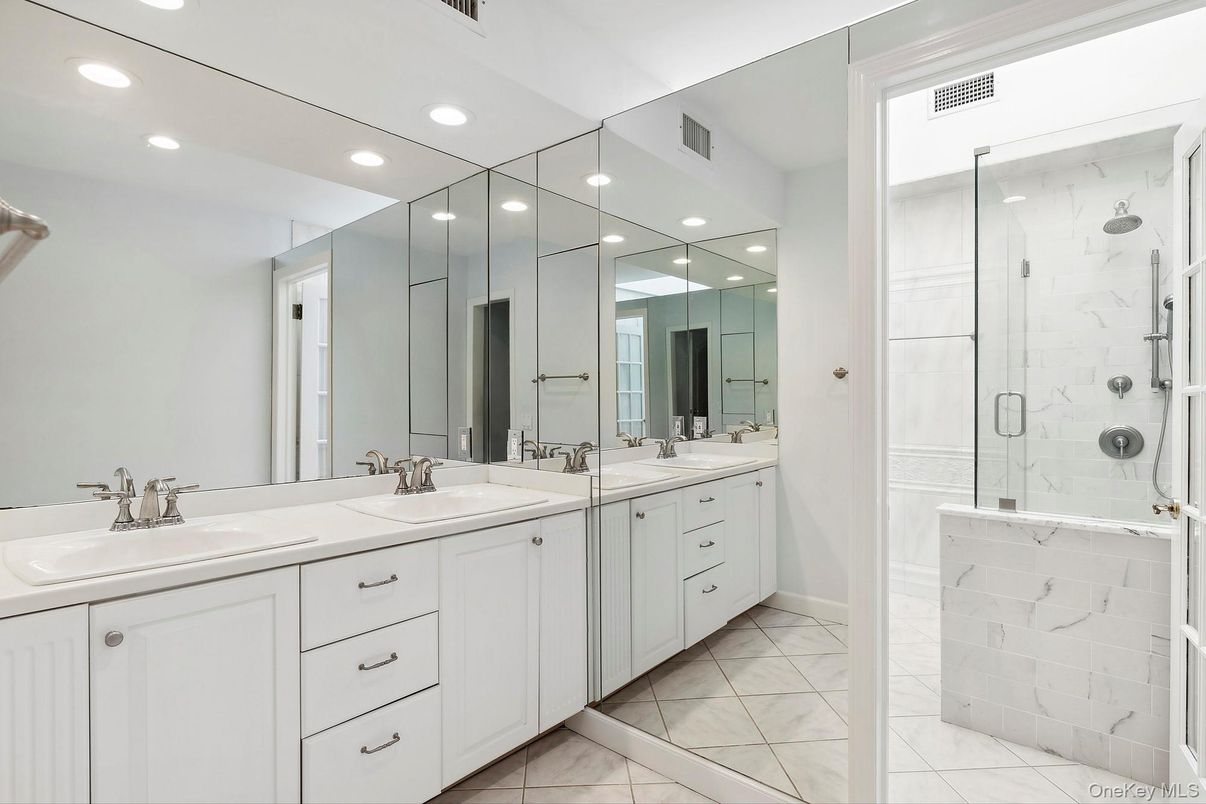 Bathroom, Dual Sink Vanities, Glass Shower, Interior, Marble, Marble Walls, Recessed Lighting