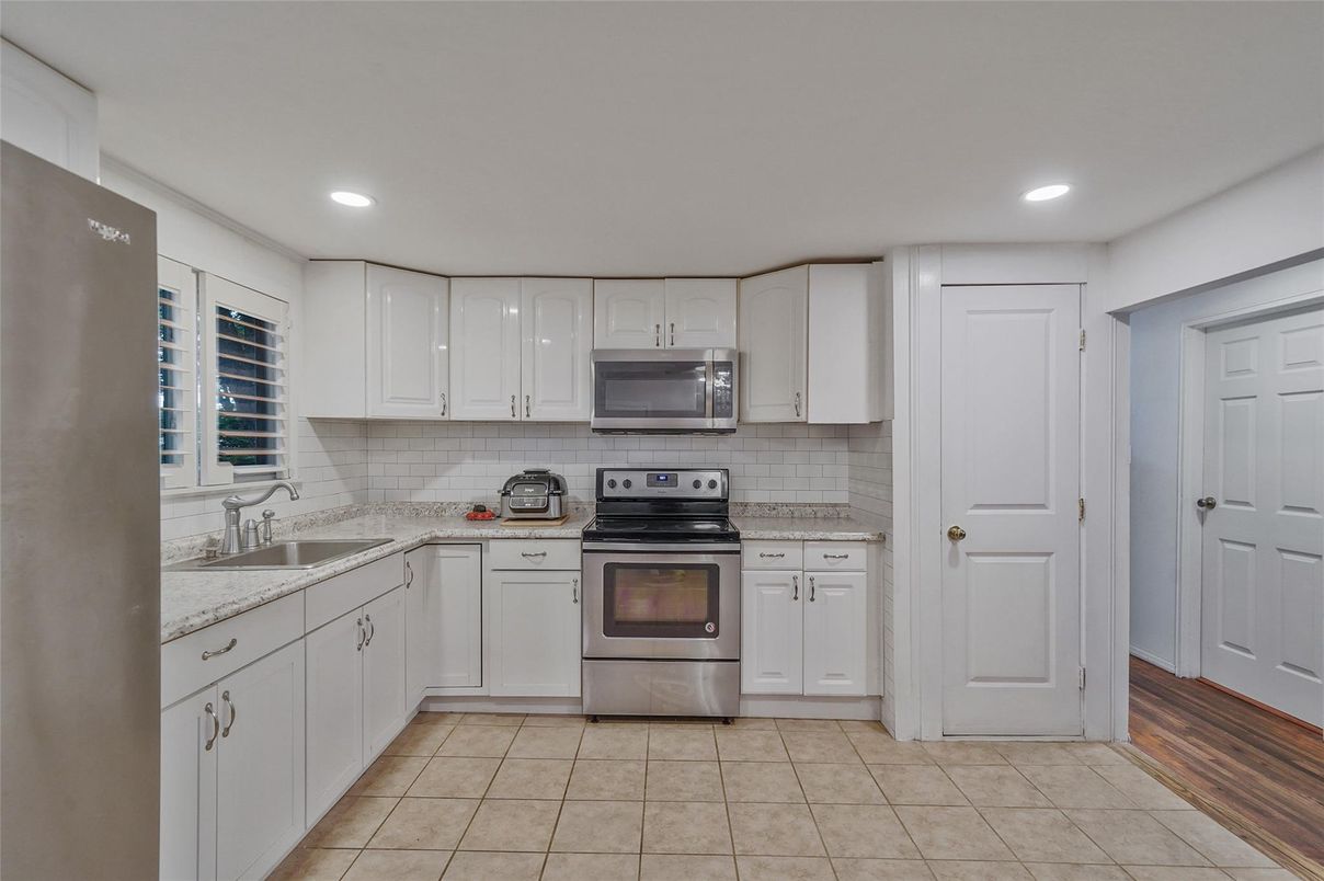 Interior, Kitchen, Recessed Lighting, Stainless Steel Appliances, Wood Texture Flooring