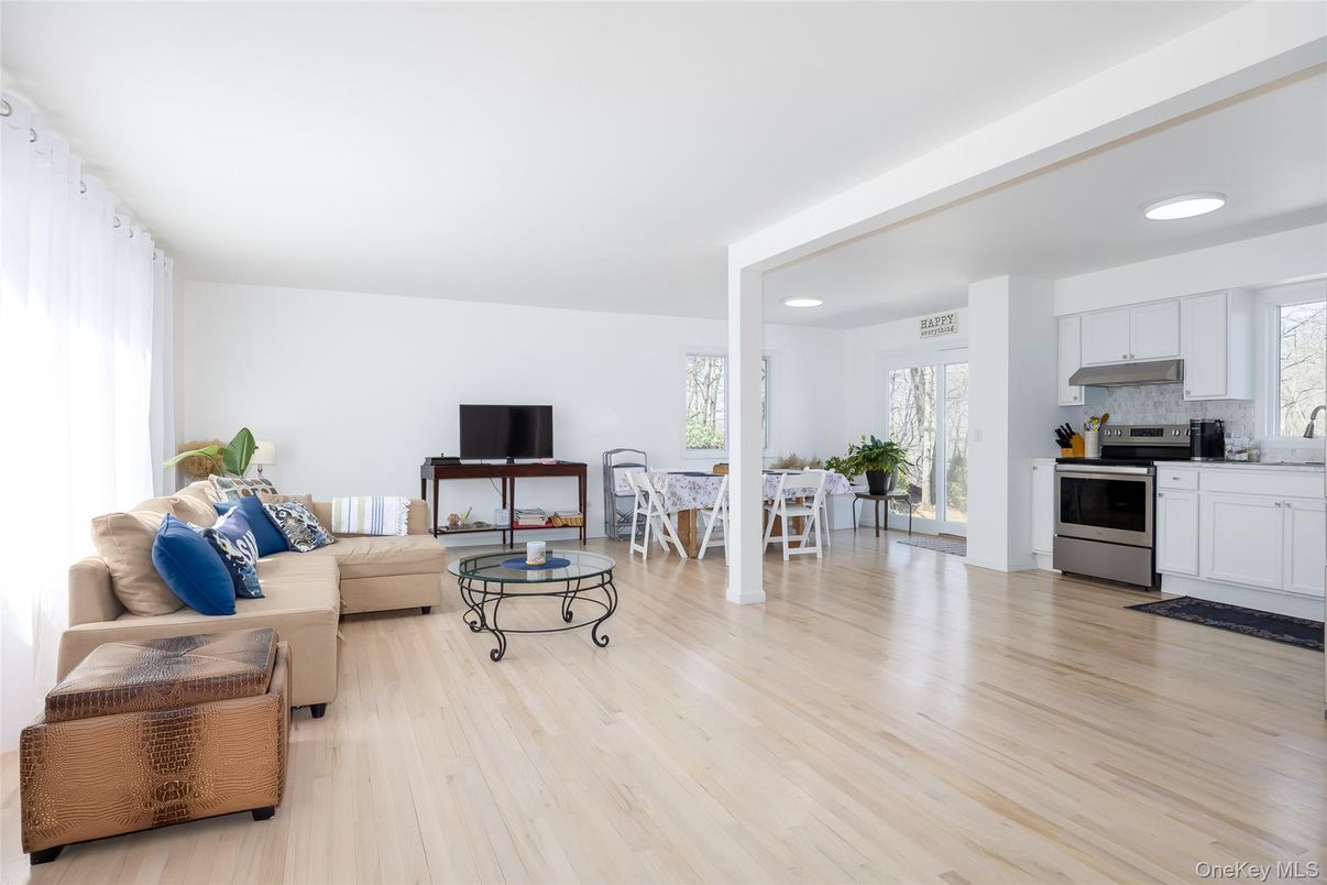 Dining room, Interior, Kitchen, Living room, Recessed Lighting, Stainless Steel Appliances, Wood Texture Flooring