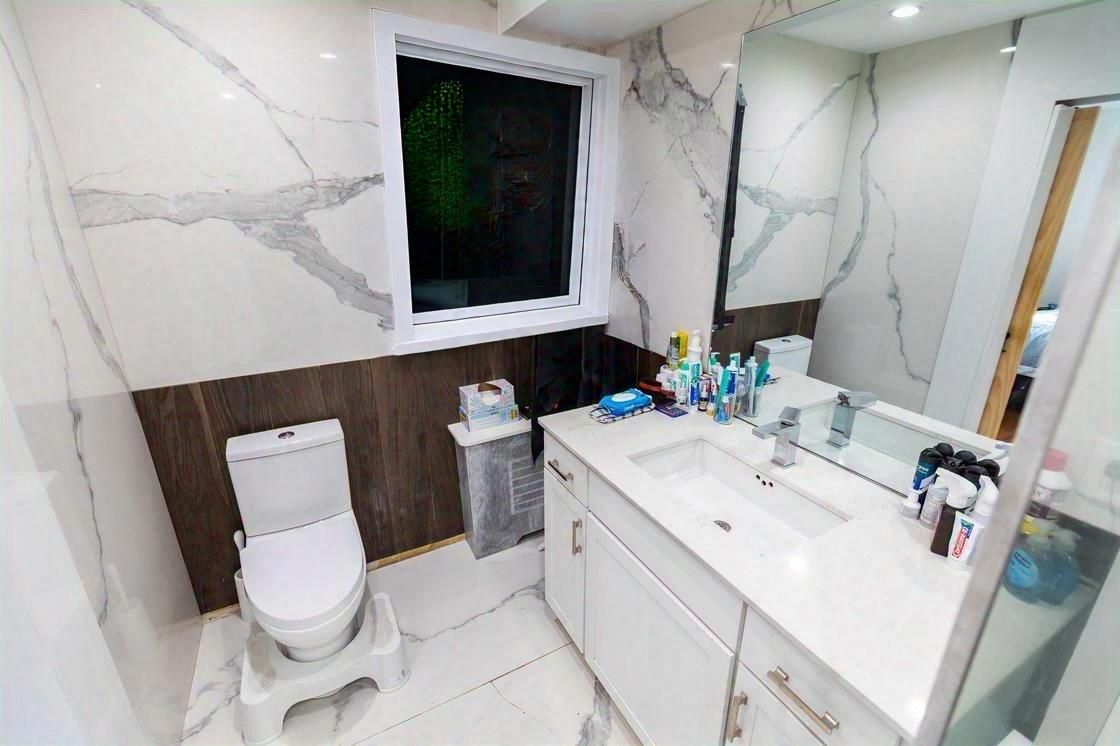 Bathroom, Dual Sink Vanities, Interior, Marble, Marble Walls, Recessed Lighting