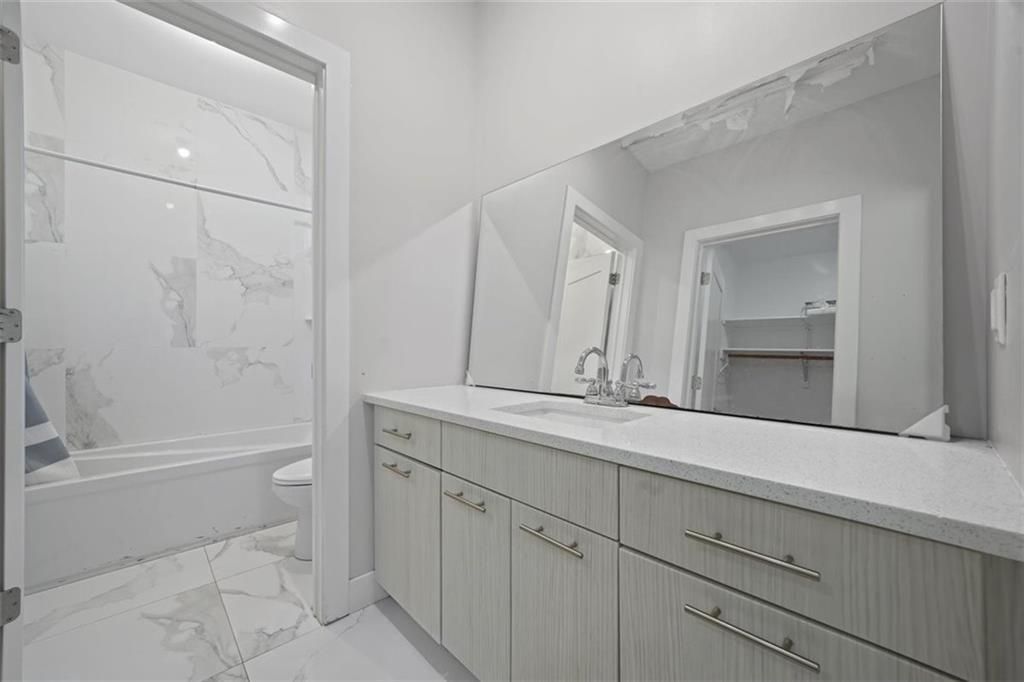 Bathroom, Dual Sink Vanities, Interior, Marble, Marble Walls, Recessed Lighting