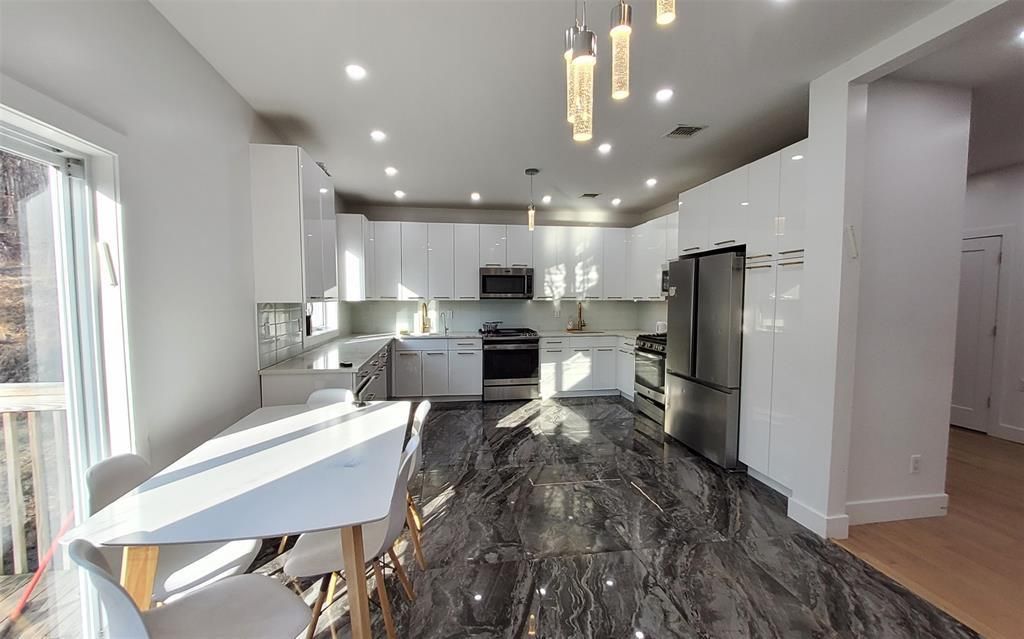 Interior, Kitchen, Marble, Pendant Lights, Recessed Lighting, Stainless Steel Appliances, Wood Texture Flooring