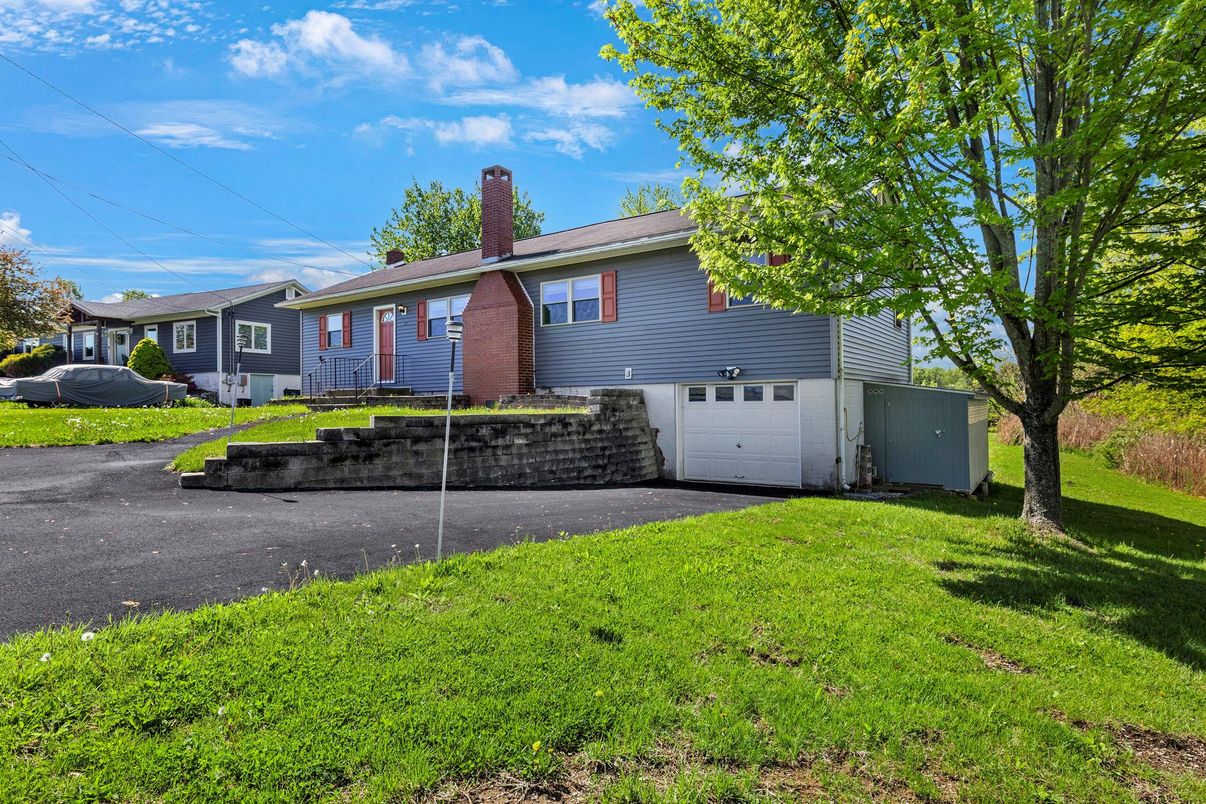 Attached, Backyard, Exterior, Facade, Brick Facade, Cape Cod