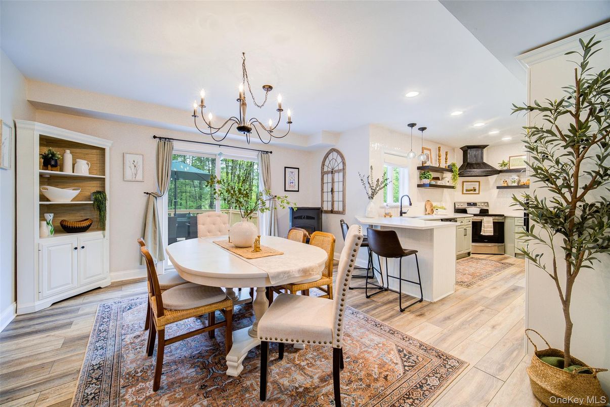 Chandelier, Dining room, Interior, Kitchen, Pendant Lights, Recessed Lighting, Stainless Steel Appliances, Wood Texture Flooring