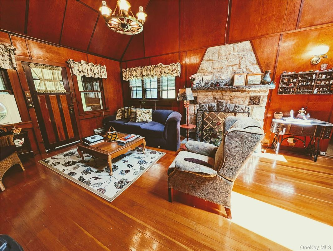 Chandelier, Fireplace, Interior, Living room, Stone Walls, Wood Texture Flooring