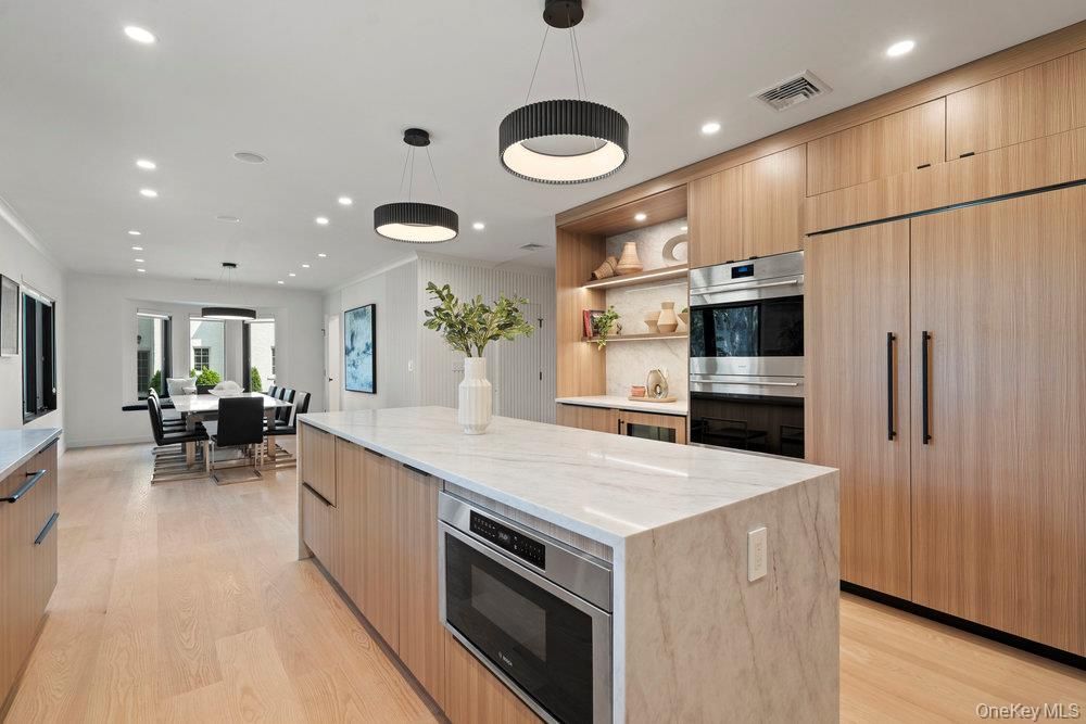 Dining room, Interior, Kitchen, Pendant Lights, Recessed Lighting, Stainless Steel Appliances, Wood Texture Flooring