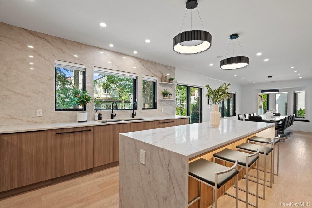 Dining room, Interior, Kitchen, Marble Walls, Pendant Lights, Recessed Lighting, Wood Texture Flooring