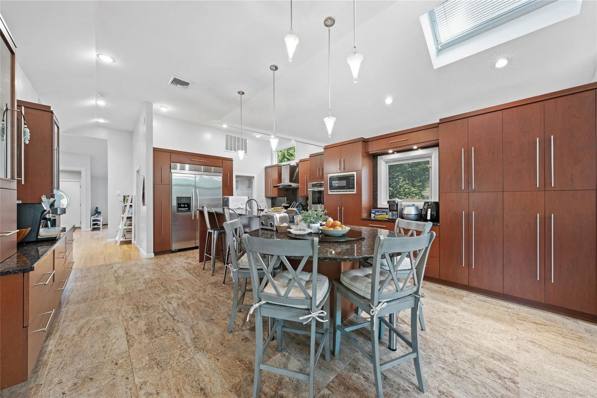 Dining room, Interior, Kitchen, Pendant Lights, Recessed Lighting, Stainless Steel Appliances, Wood Texture Flooring