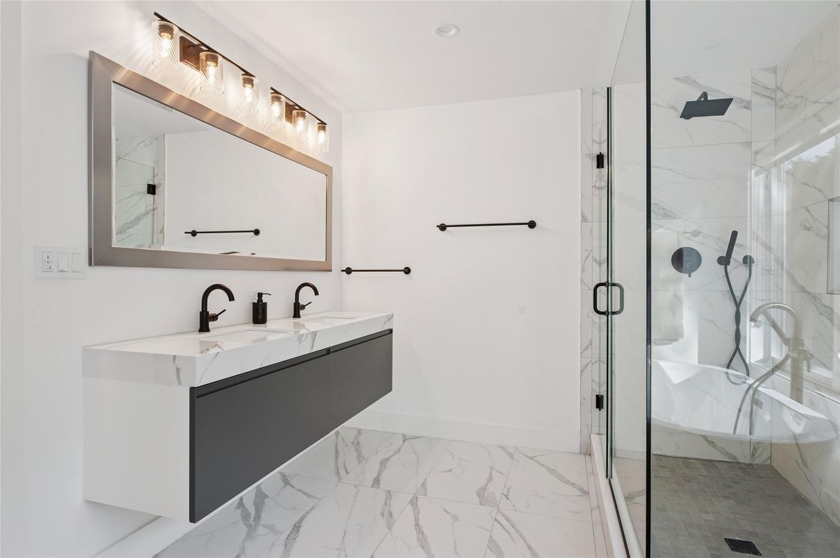 Bathroom, Dual Sink Vanities, Glass Shower, Interior, Marble, Marble Walls, Recessed Lighting