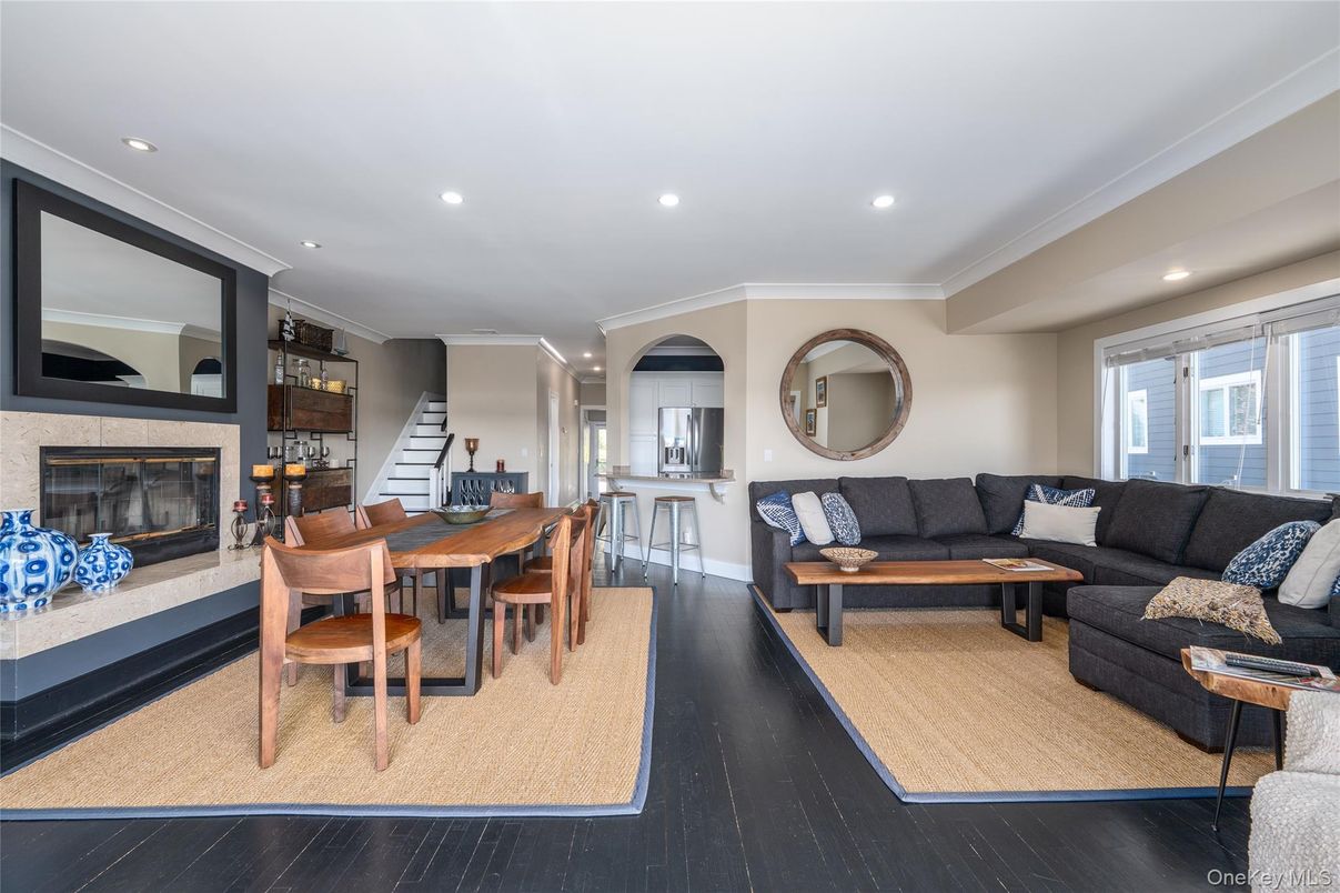 Dining room, Fireplace, Interior, Living room, Recessed Lighting, Wood Texture Flooring