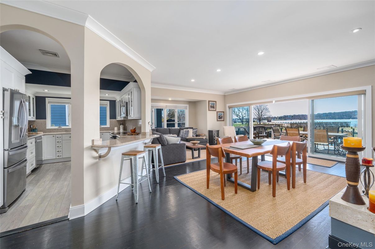 Dining room, Interior, Kitchen, Living room, Recessed Lighting, Stainless Steel Appliances, Water, Wood Texture Flooring