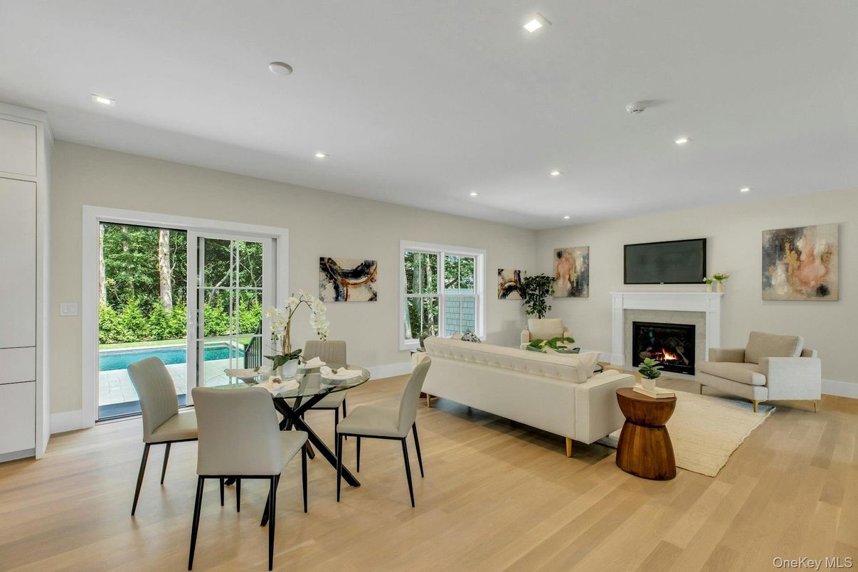 Dining room, Fireplace, Interior, Living room, Recessed Lighting, Wood Texture Flooring