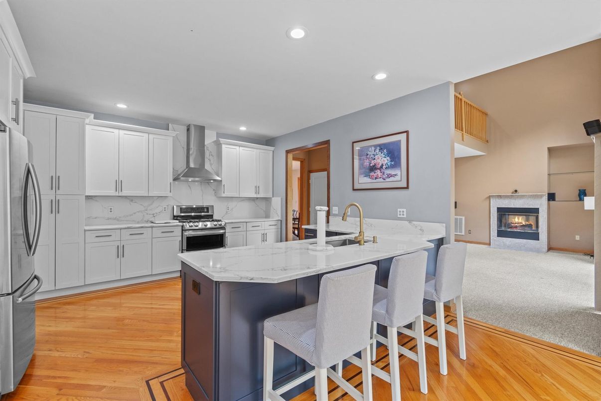 Fireplace, Interior, Kitchen, Recessed Lighting, Stainless Steel Appliances, Wood Texture Flooring