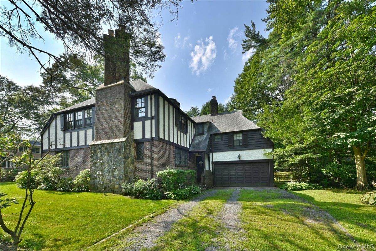 Attached, Backyard, Exterior, Facade, Brick Facade, Tudor Revival