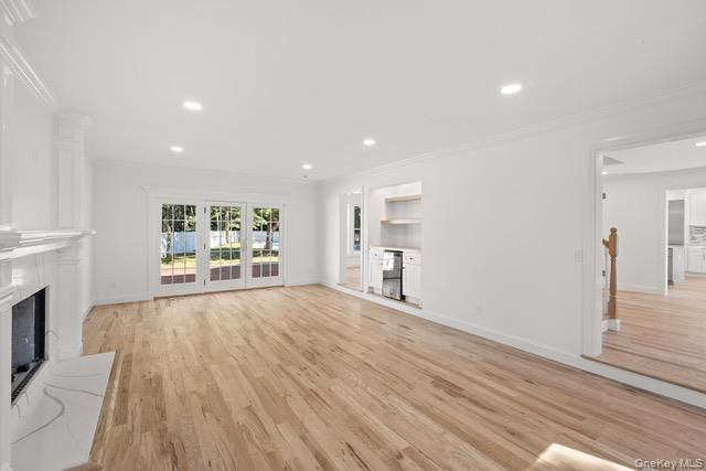Empty room, Fireplace, Interior, Kitchen, Recessed Lighting, Wood Texture Flooring